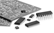 Photo of various sizes of microchips and blank pc boards