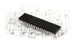 photo of computer chip setting on a schematic drawing